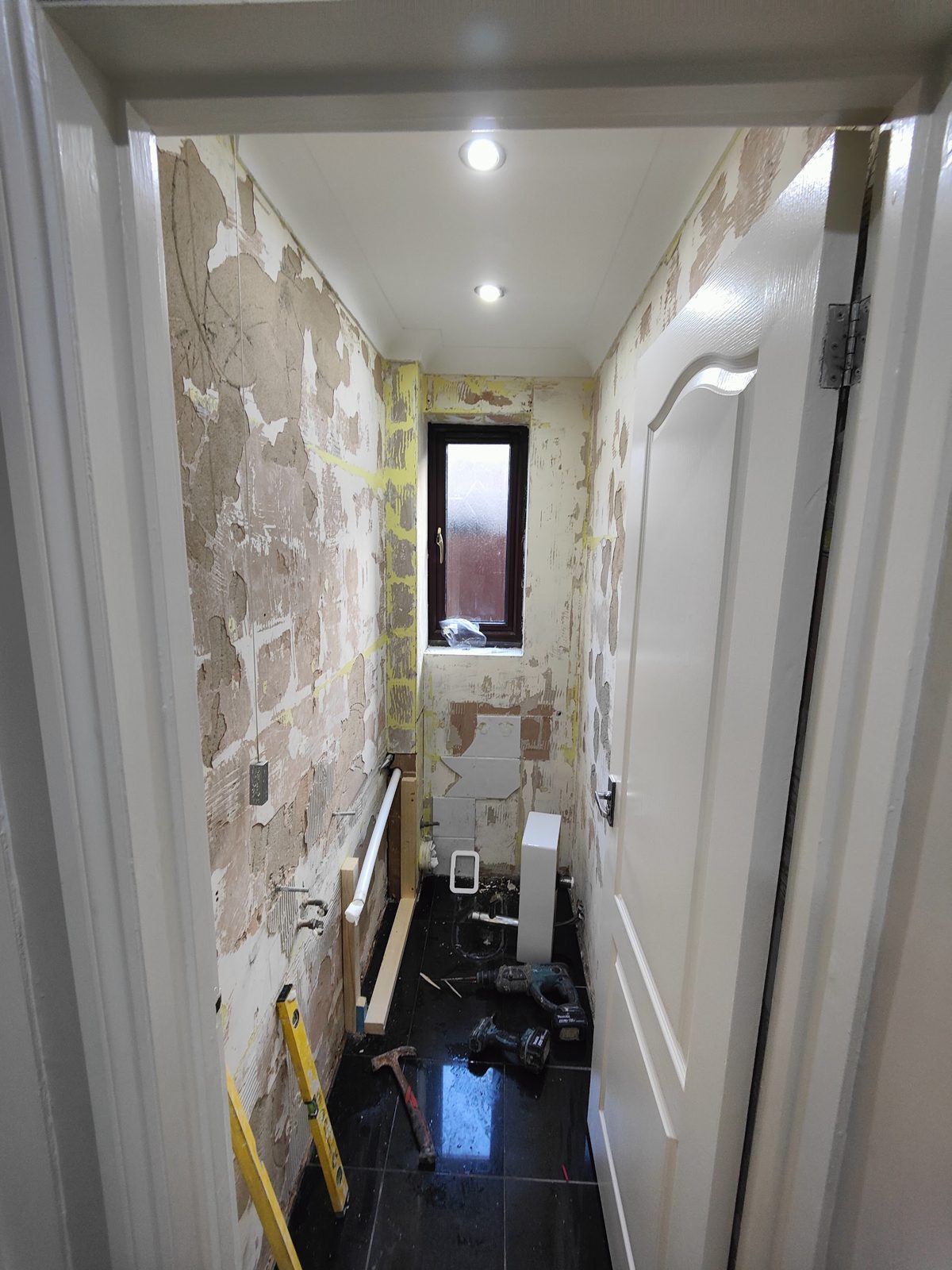 Cloakroom part way through, walls being replastered