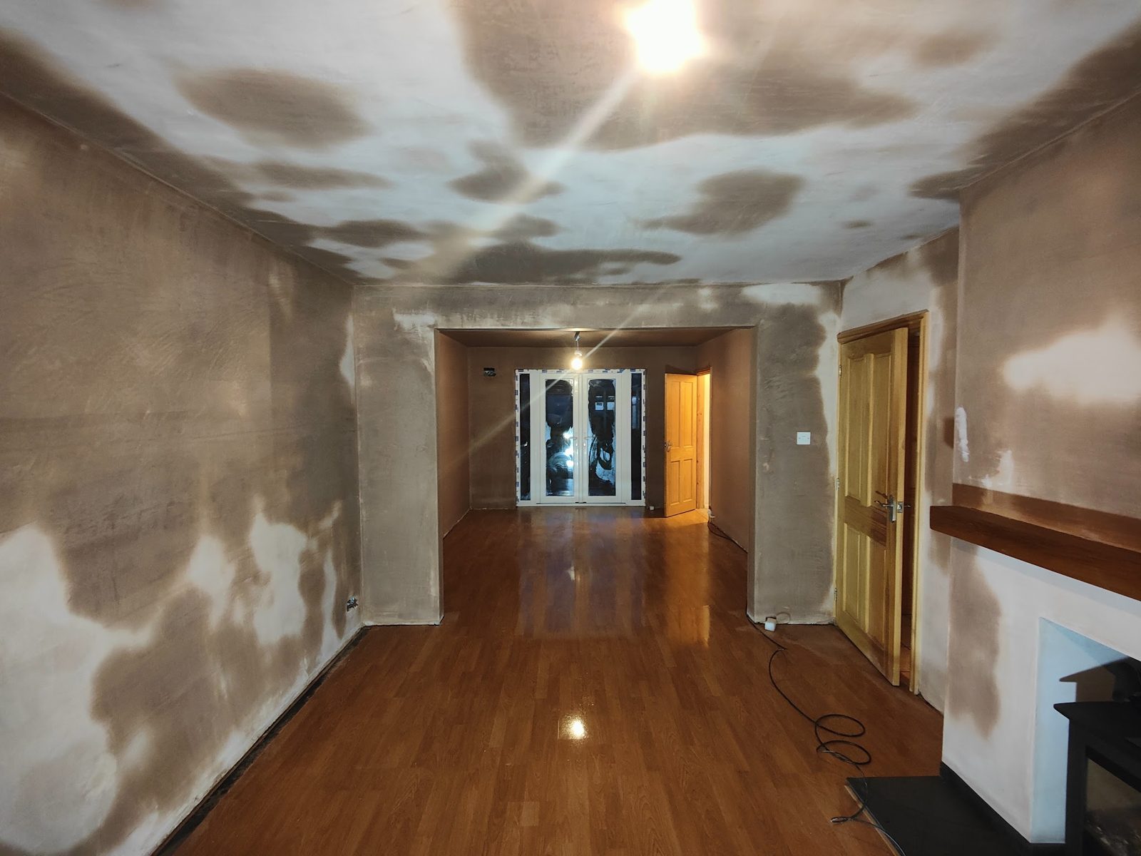 Long through lounge, walls and ceiling plastered and drying out